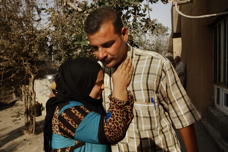 Police officer Zihad Farhan, right, is welcomed home on Thursday, Oct. 27, 2016, by his mother Bisha Khalil, in the village of Hurriya, where fighting between ISIS and Iraqi forces caused them to leave some three months ago. The homecoming was dampened by the kidnapping of Zihads 18-year-old brother, Ibrahim Farhan, by ISIS militants last week. (Carolyn Cole/Los Angeles Times/TNS)
