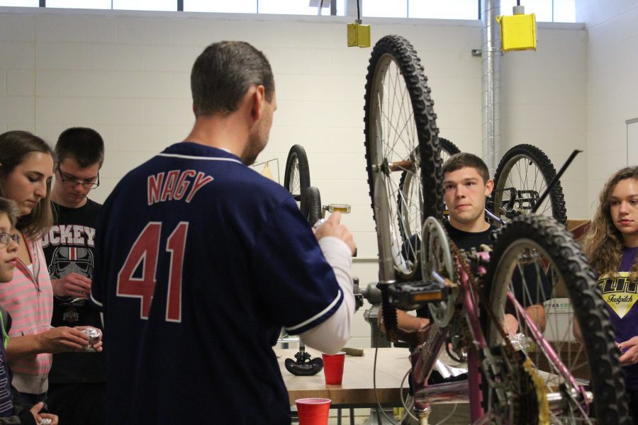 Bike Club works hard on repairing bikes. 