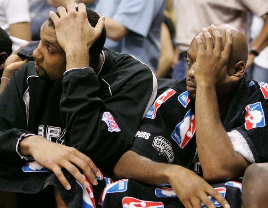 San Antonio Spurs players Tim Duncan, left, and Nick Van Exel sit on the bench late in the fourth after Duncan fouled out. The Mavericks defeated the Spurs 104-103, during the first half of Game 3 of the Western Conference Semifinals at the American Airlines Center in in Dallas, Texas, Saturday, May 13, 2006. (Brad Loper/Dallas Morning News/KRT)