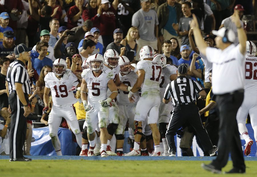 Stanford+wide+receiver+JJ+Arcega-Whiteside+%2819%29+celebrates+with+teammates+after+catching+the+go-ahead+touchdown+against+UCLA+defensive+back+Nate+Meadors+%2822%29+late+in+the+fourth+quarter+at+the+Rose+Bowl+in+Pasadena%2C+Calif.%2C+on+Saturday%2C+Sept.+24%2C+2016.+Stanford+won%2C+22-13.+%28Gina+Ferazzi%2FLos+Angeles+Times%2FTNS%29