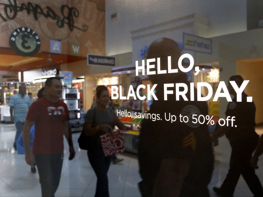 Stores advertise Black Friday sales to draw the attention of shoppers on Thanksgiving, Thursday, Nov. 24, 2016 at Dolphins Mall. Shoppers headed to the mall for their holiday shopping and savings. (Carl Juste/Miami Herald/TNS)