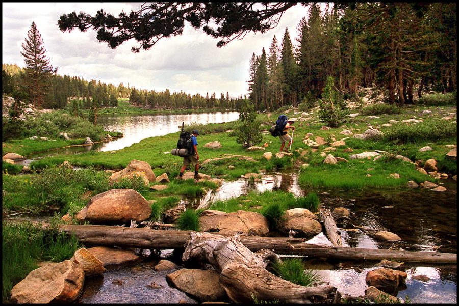 In a 2005 file image from high in the John Muir Wilderness, backpackers enter Sallie Keyes Lakes, elevation 10,002, from Selden Pass along the John Muir Trail. A new study suggests that a couple days of camping in the great outdoors can reset your circadian clock and help you get more sleep. (Ken Hively/Los Angeles Times/TNS)