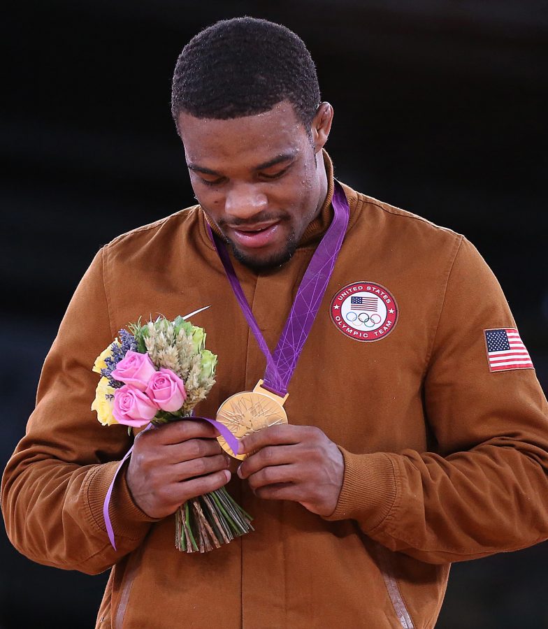 United+States+wrestler+Jordan+Burroughs+admires+the+gold+medal+he+earned+by+winning+the+mens+-74kg+wrestling+competition+at+the+Summer+Olympics+at+the+Excel+Arena+in+London%2C+England%2C+on+Friday%2C+August+10%2C+2012.+%28Robert+Gauthier%2FLos+Angeles+Times%2FMCT%29