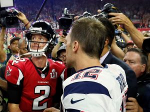 Atlanta Falcons quarterback Matt Ryan looks to the scoreboard as he congratulates New England Patriots quarterback Tom Brady on the Patriots' victory. The Atlanta Falcons lost to the New England Patriots in overtime, 34-28, in Super Bowl LI on Sunday, Feb. 5, 2017 at NRG Stadium in Houston, Texas. (Bob Andres/Atlanta Journal-Constitution/TNS)