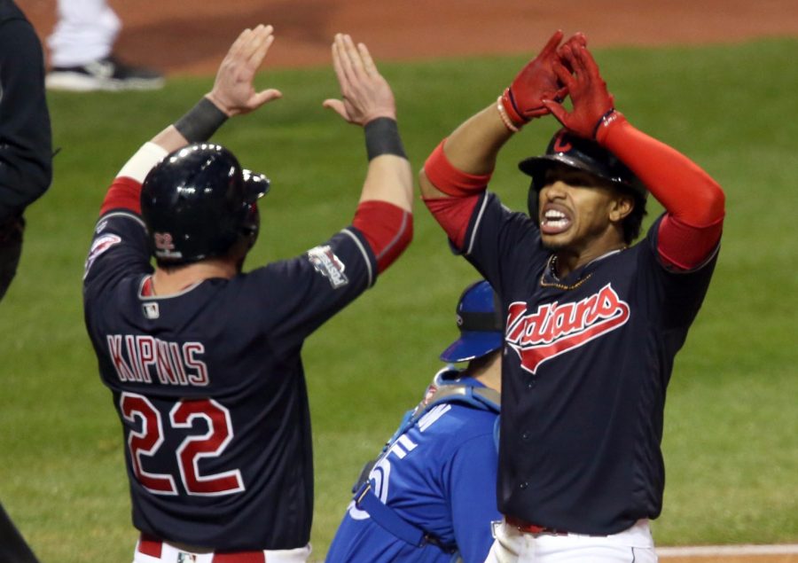 The Cleveland Indians Francisco Lindor, right, celebrates with Jason Kipnis after hitting a two-run home run against the Toronto Blue Jays in the sixth inning during Game 1 of the American League Championship Series Friday, Oct. 14, 2016, at Progressive Field in Cleveland. The Indians won, 2-0. (Phil Masturzo/Akron Beacon Journal/TNS)