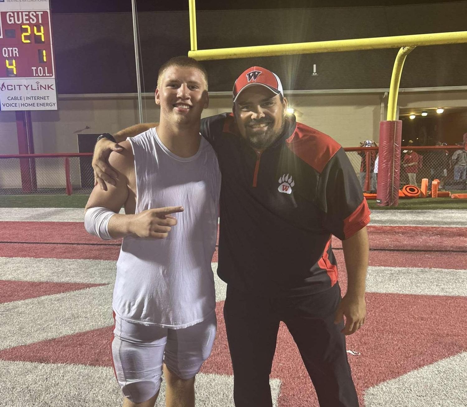 Luke Ryder and Coach Porchowsky pose for a picture after the big win against the Twinsburg Tigers. Both the coaches and the players were proud about this big win.  