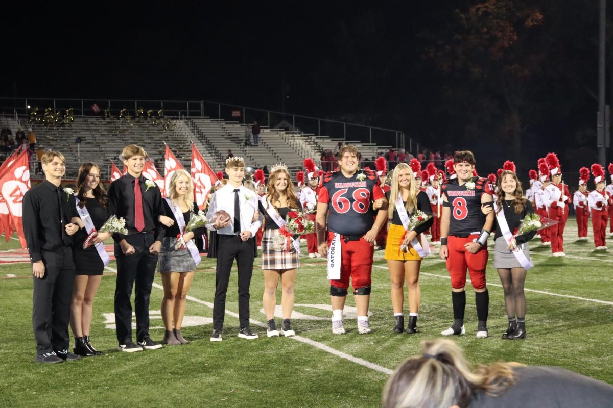 The court poses together after the king and queen are announced. After this, the Grizzlies took a victory over Stow with a score of 49-7. Photo by Riley Hunt.