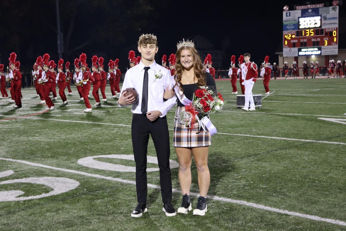 Jake Schmeltzer and Lotus Lemp are crowned homecoming king and queen. The previous years king and queen typically return to crown the new king and queen. Photo by Riley Hunt. 