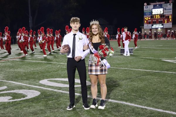 Jake Schmeltzer and Lotus Lemp are crowned homecoming king and queen. The previous years king and queen typically return to crown the new king and queen. Photo by Riley Hunt. 