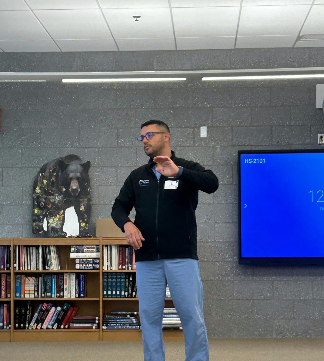 Dr. Derek Klaus in the WHS Media Center talking to students about careers in Orthopedic Surgery.  Klaus is a graduate of WHS. Photo by Lizzy Edwards.