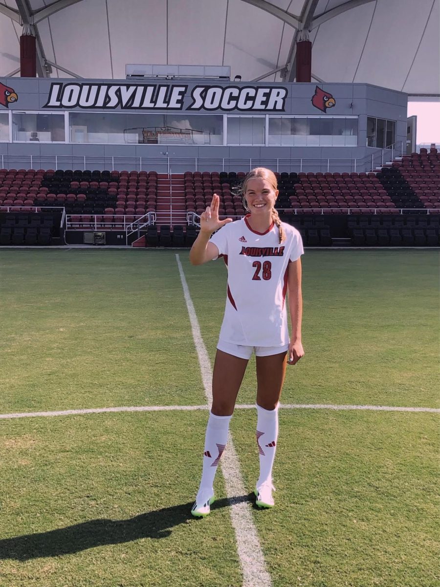 Ella Bard poses for picture in the University of Louisville stadium. Bard has dreamed of playing D1 since she was little. Photo Courtesy of Ella Bard.