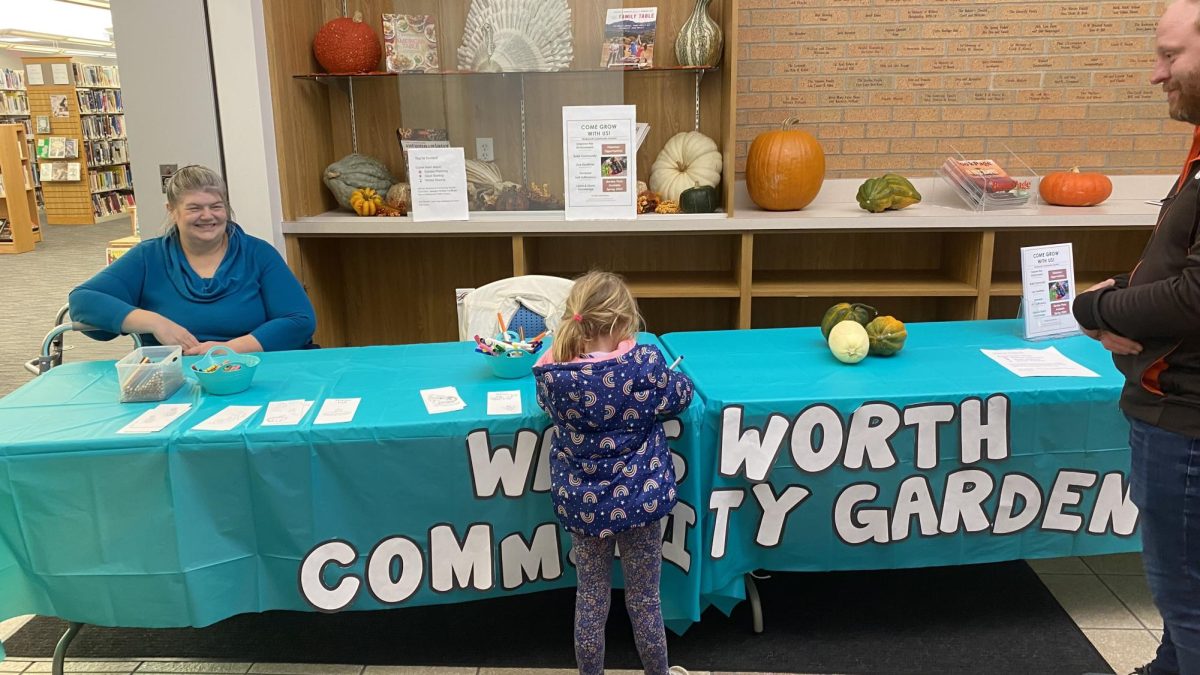 The Wadsworth Community Garden held a booth inside the Wadsworth Public Library. The table had a craft as well as some information about the garden. Photo by Larkin Tackett.
