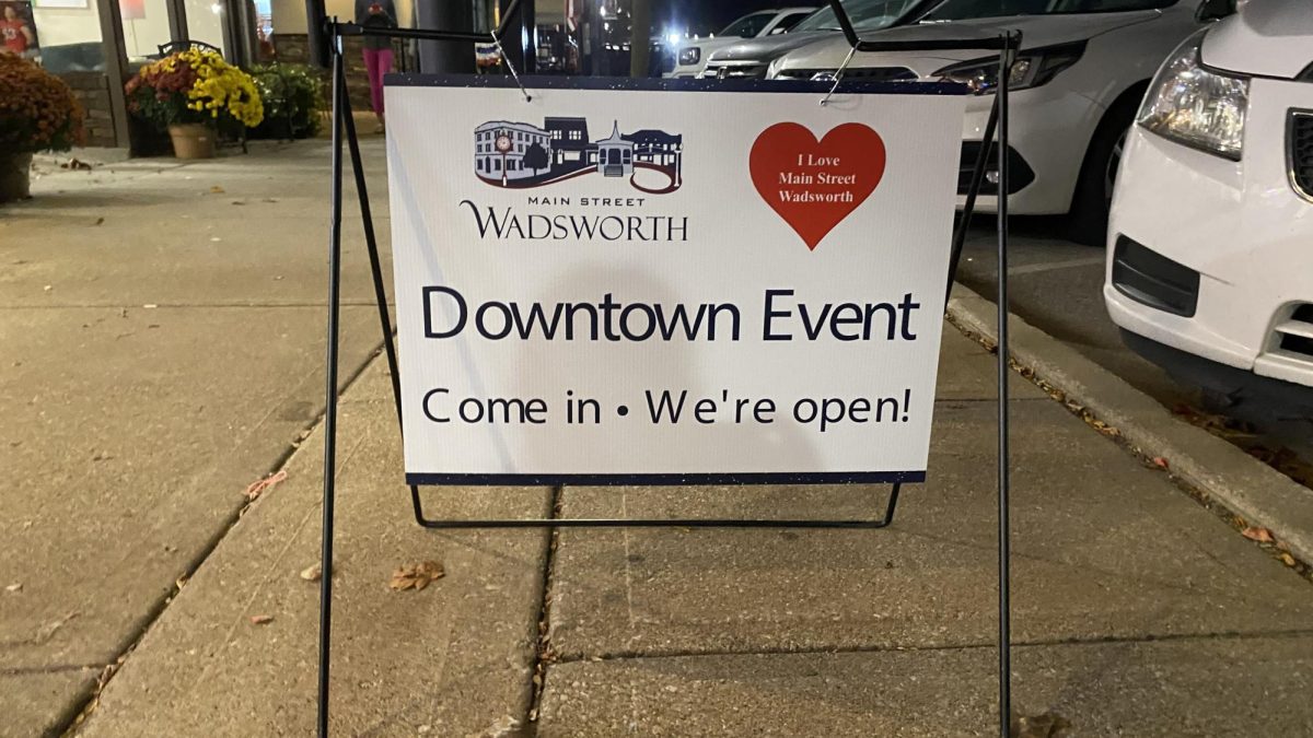 One sign, of many, downtown showing which businesses are participating in the First Friday event. This sign was in front of Sweets on High. 
