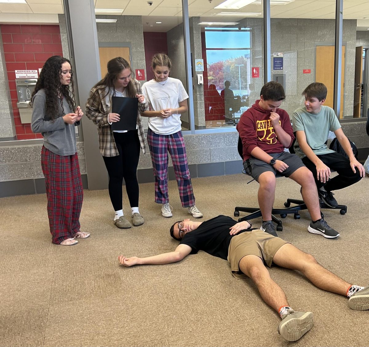 One of the opening scenes of the play is practiced by Zionna Redmon (12), Kinsey Nussbaum (10), Carsyn Derrig (12), Connor McNeill (9), Aiden Bigler (11), and Jack Mallory (10). The production just finished the blocking process.  Photo by Maia Edwards.