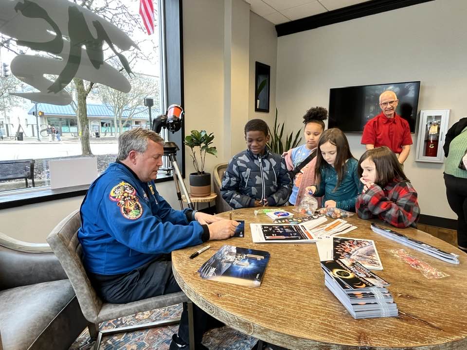 Mike Foreman, NASA astronaut, autographing pictures of him for the First Friday attendees. Foreman worked with Tom Stugmyer along with the Wadsworth Public Library. Photo Courtesy of Tom Stugmyer.  