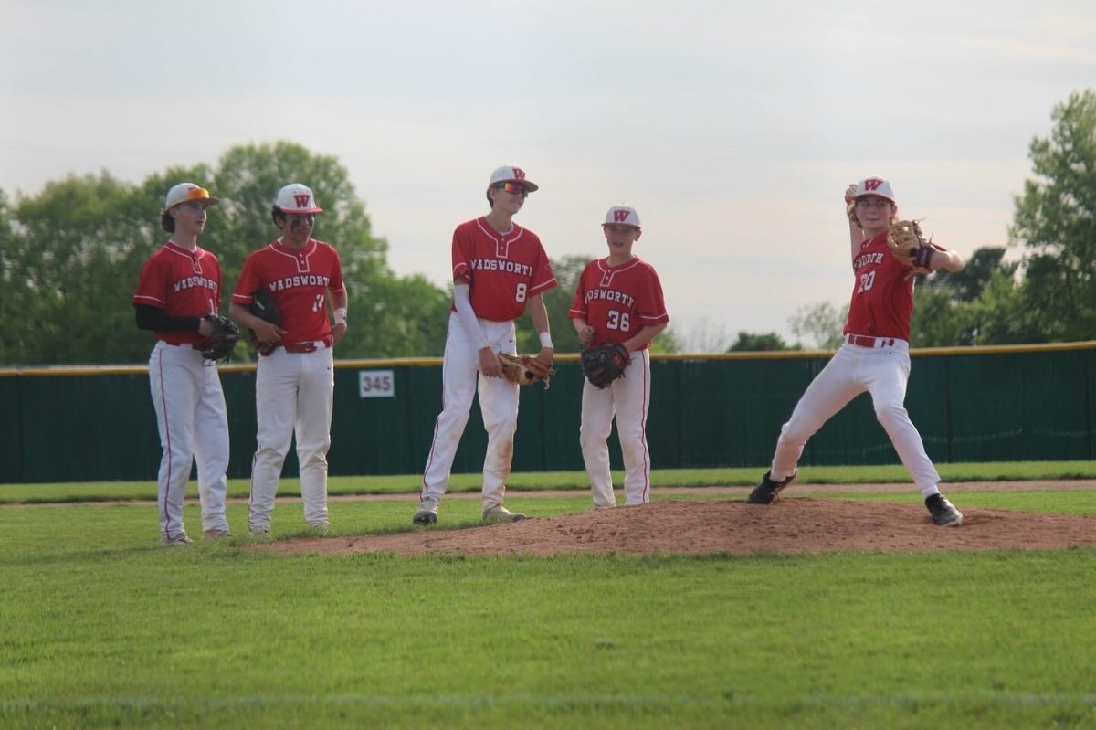 Brody Carbaugh (9) goes up to pitch as his teammates watch. This took place against Wooster High School on May 8, 2024 on the WHS Baseball Field. Photo courtesy of Chad Gray.

