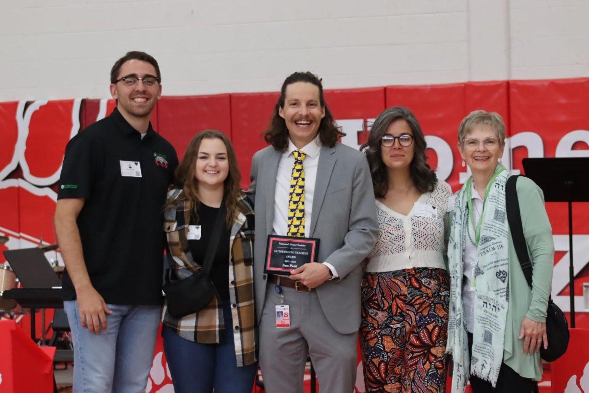 Piehl poses for a photo with his family after being awarded Teacher of the Year. This was his last year teaching at Wadsworth Schools. Photo by Reagan Hunt. 