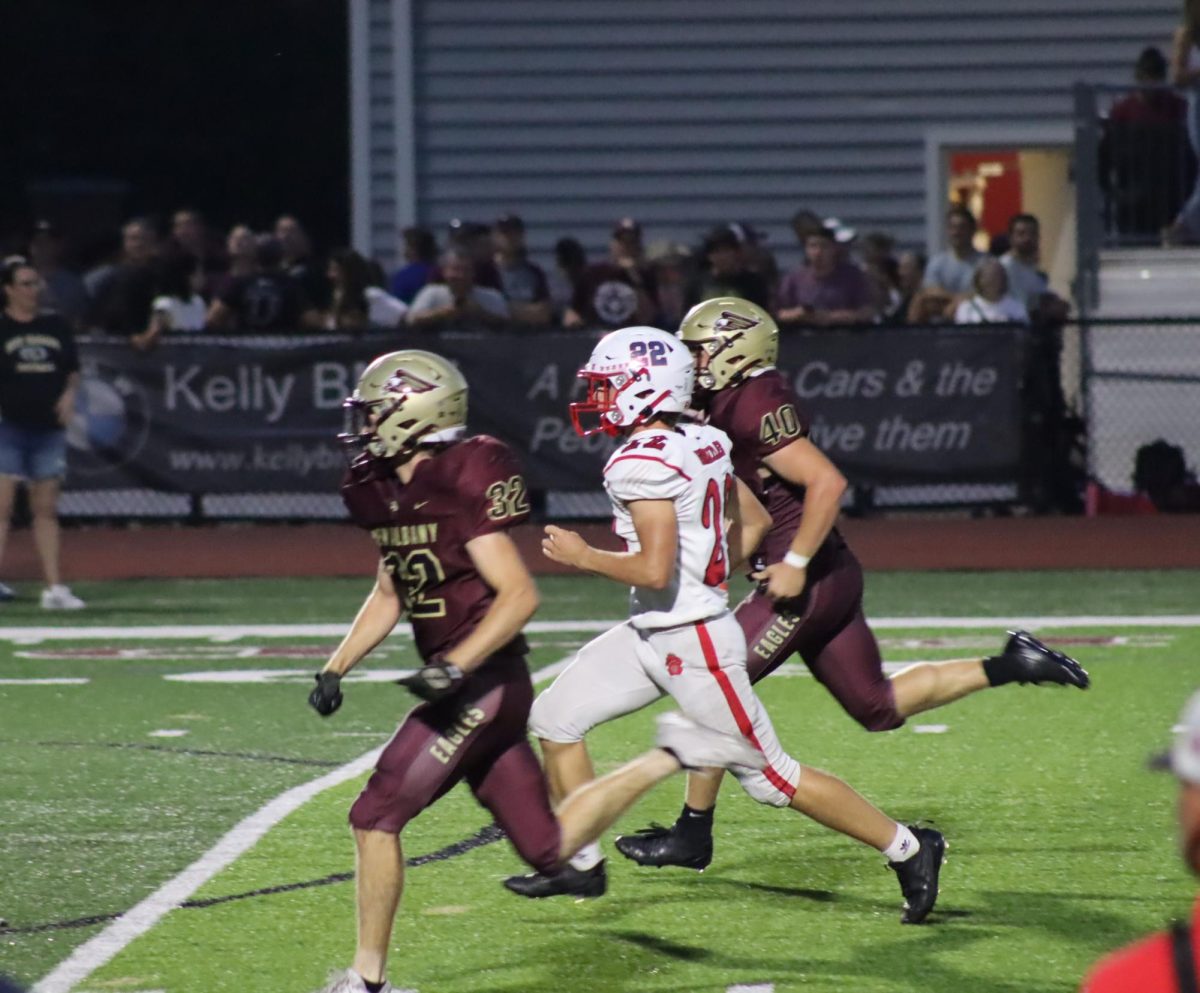 Dominic Jackson runs along side New Albany players. During the third quarter, Jackson tried to out run New Albany players to block them from the ball.
