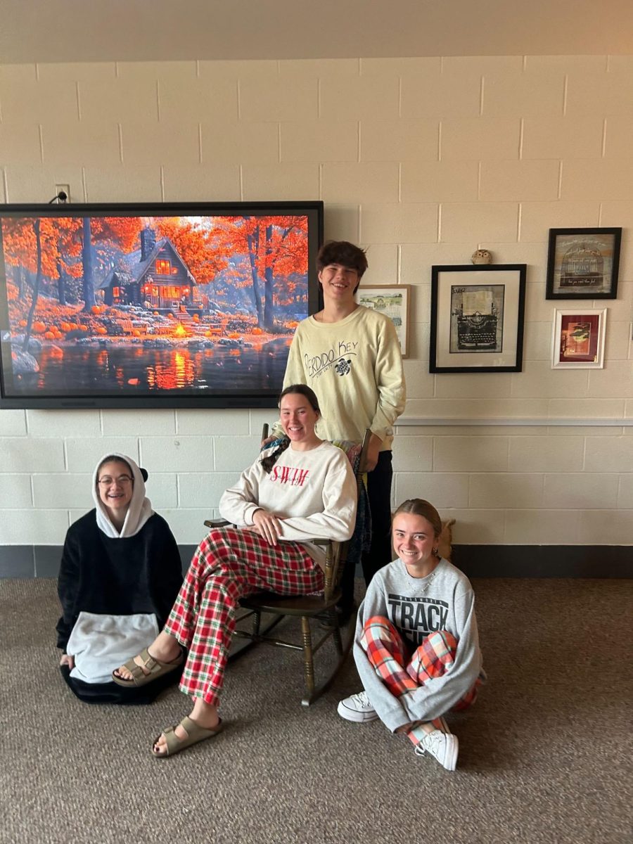 Rebecca Wesig, Reagan Bach, Joseph Maag, and Burgan Danger wearing pajamas for the first day of spirit week. All students are in Mrs. Trausch's Advanced Placement  Literature class. Photo by Hadley James.
