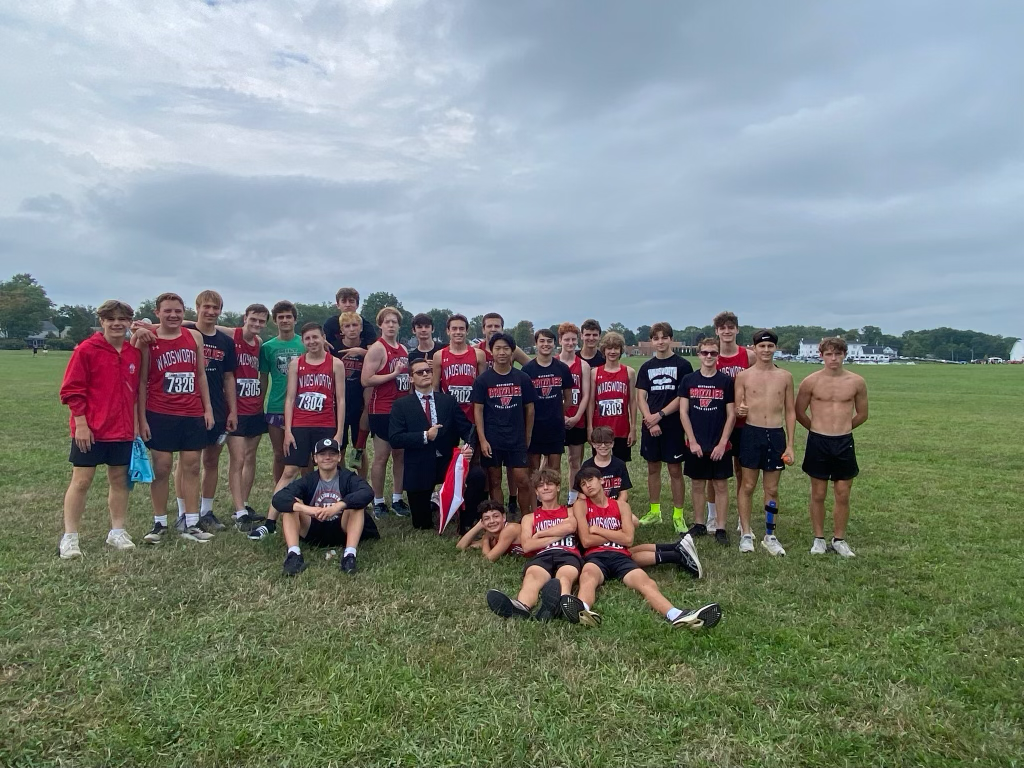 The Wadsworth High School’s cross country team after their meet at Ashland on August 31, 2024. After each race, the team gives each other team shoutouts and reflects on their performances. Photo courtesy of Natalie Heisler. 
