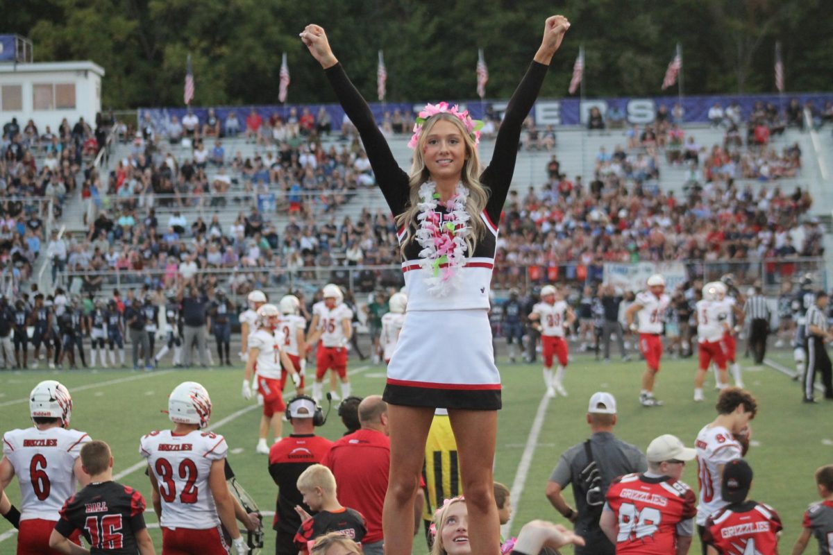 Emma Lynn poses for a stunt as a flyer for her Stunt group. The football game was away and Wadsworth was playing Twinsburg, which resulted in winning 55-10. Photo courtesy of Claire Harig.
