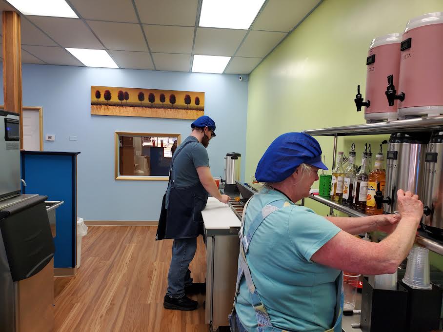 David Dickey Jr. (back) and Tracey Dickey (front) prepare an order of tea for a customer. The Dickeys have been working on the establishment since January of 2024. Photo by Lily Roden
