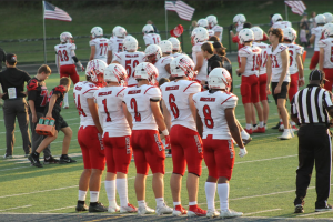 Gavin Madigan stands and waits for the game against the Twinsburg Tigers to begin. The game occurred on September 13, 2024. Photo courtesy of Claire Harig.