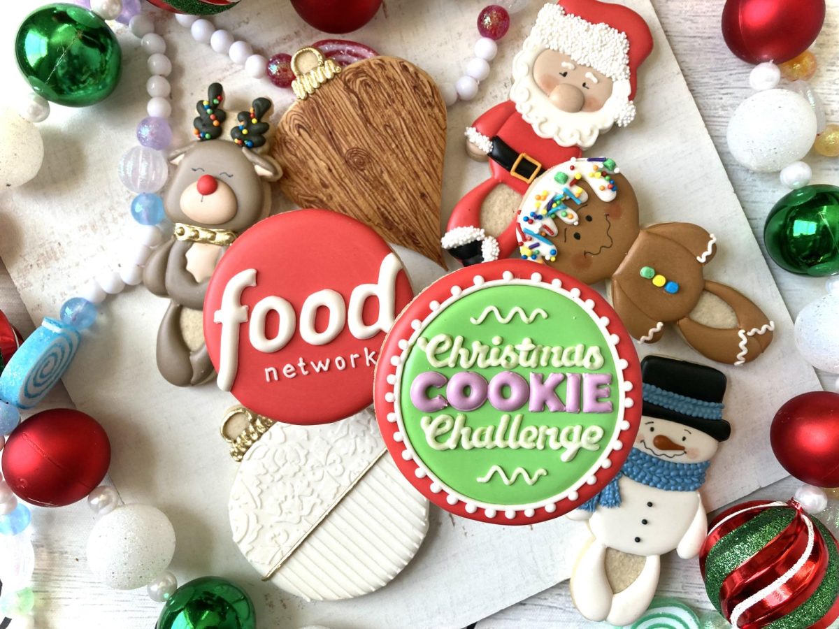 Veronica (Vee) Andexler shows off her artistic and baking skills through her custom cookies, displaying the Food Network and Christmas Cookie Challenge logo. Andexler handmade the cookies shown in this image. Photo courtesy of Vee Andexler. 
