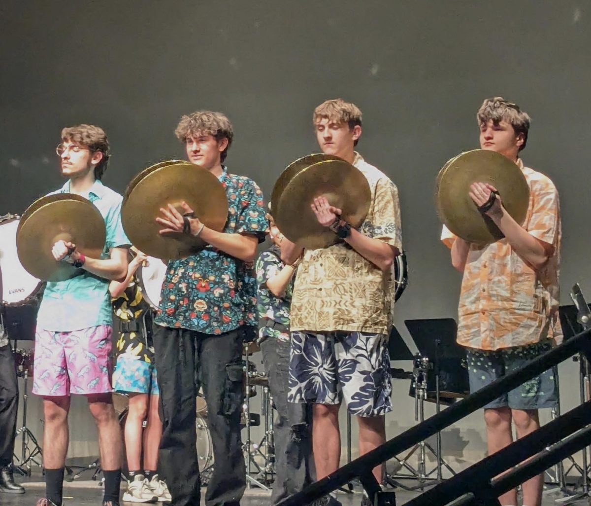 Pictured here from left to right is Gavin Parks, Jeremiah Workman, Aiden Nauert-weese and Calvin Kopfstein. They are performing in the drumline segment of the night. Photo by Izi Lewis. 