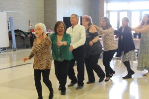 Senior citizens dance at the Spring Fling. Student Council helped organize the event. Photo by Claire Harig.