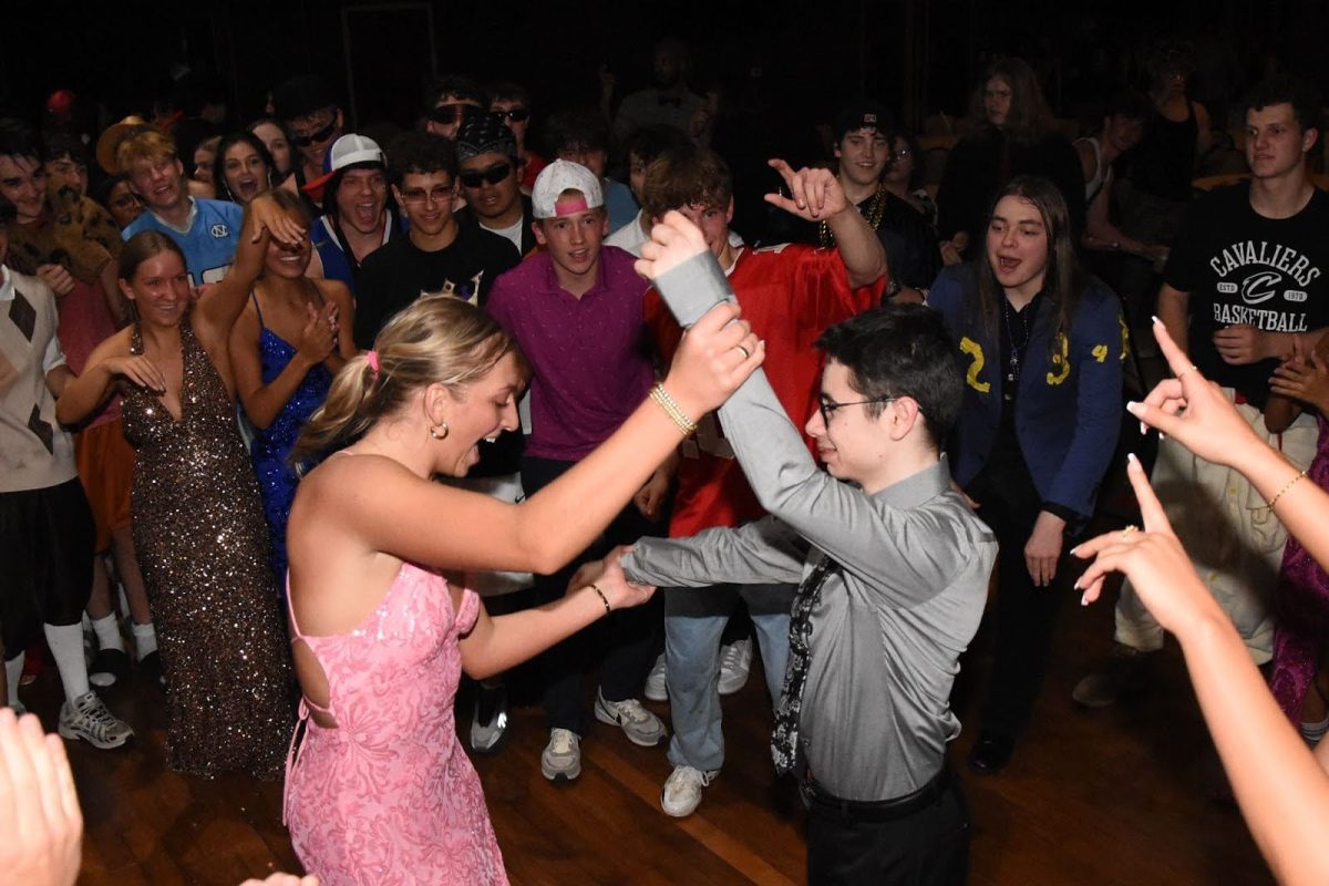Lillian Mccomas (left) and Matthew Reed (right) are seen dancing in the center of the dance floor.