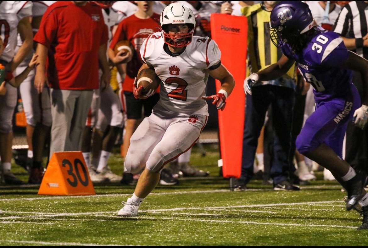 Gavin Madigan playing running back for the Wadsworth Grizzles against the Barberton Magic. Wadsworth ended up winning this football game 42-0. Photo Courtesy of Cade Tomko.