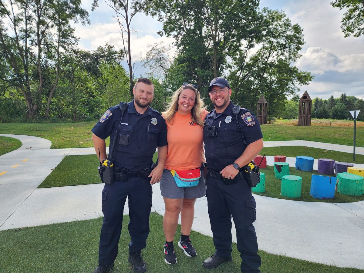 Officer Nate Ball, a teacher and resource officer for Safety Town and the director of Safety Town, April Jira. They have been working together for Safety Town for a while, each working with kids hands-on to teach the curriculum on how to be a safe and responsible civilian and student. They are currently preparing for the summer of 2025 students.