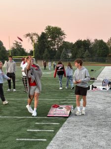 A couple seniors play Cornhole. This was one of the games to occur during senior sunrise.