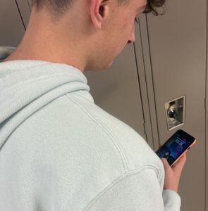 Junior, Drake Fairbanks, on his phone in the hallways at Wadsworth High School. As of right now, you are not allowed to be on your cell phone during the change time in between class periods.