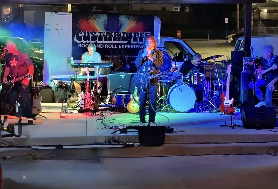Custard Pie performs for their crowd at Wads-toberfest. They were performing the song "Mr. Crowley" by Ozzy Osbourne.