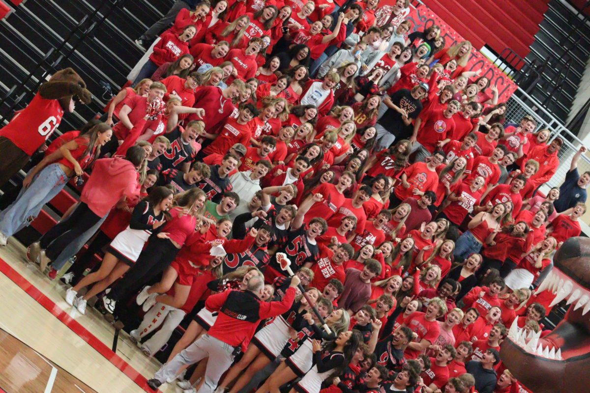 Class of 2026 receiving their school spirit stick after winning the most points at the pep rally. Seniors were wearing red representing their class color.