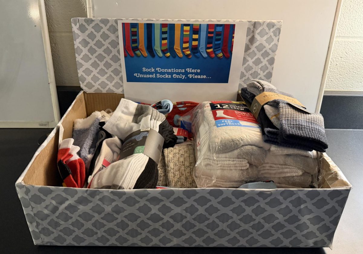 The box where students and staff are meant to drop off the socks in Mrs. Rosenberger's room. Go to room 2408 with any donations for the drive.