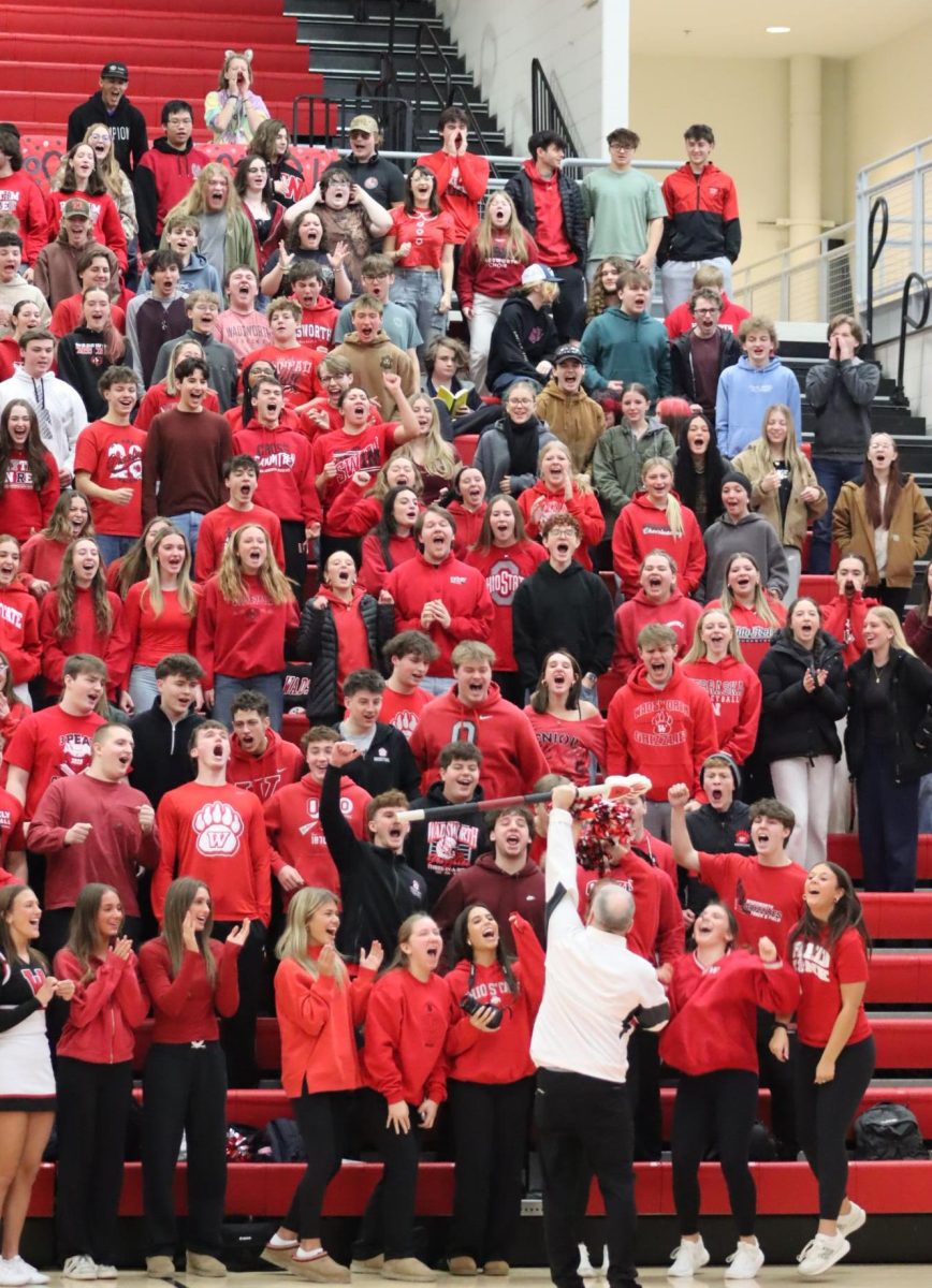  Rich Berlin congratulates seniors with the school spirit stick. Seniors won by having the loudest “Do it” chant.
