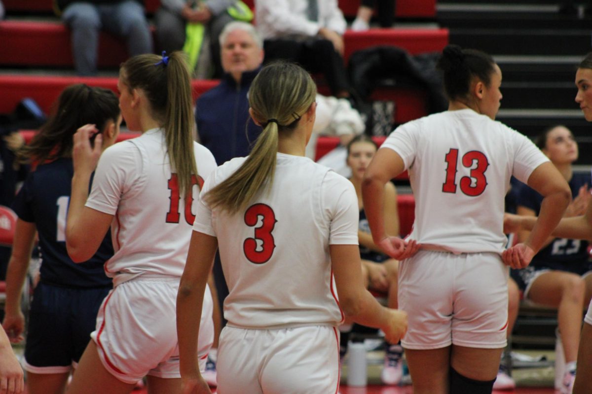 Varsity Basketball players, Lauren 
Decker, Natalie Maddox and Marah 
Minor (left to right) lineup as they wait for the game to startup again. This game was at home versus Hudson, and the Grizzlies won. 