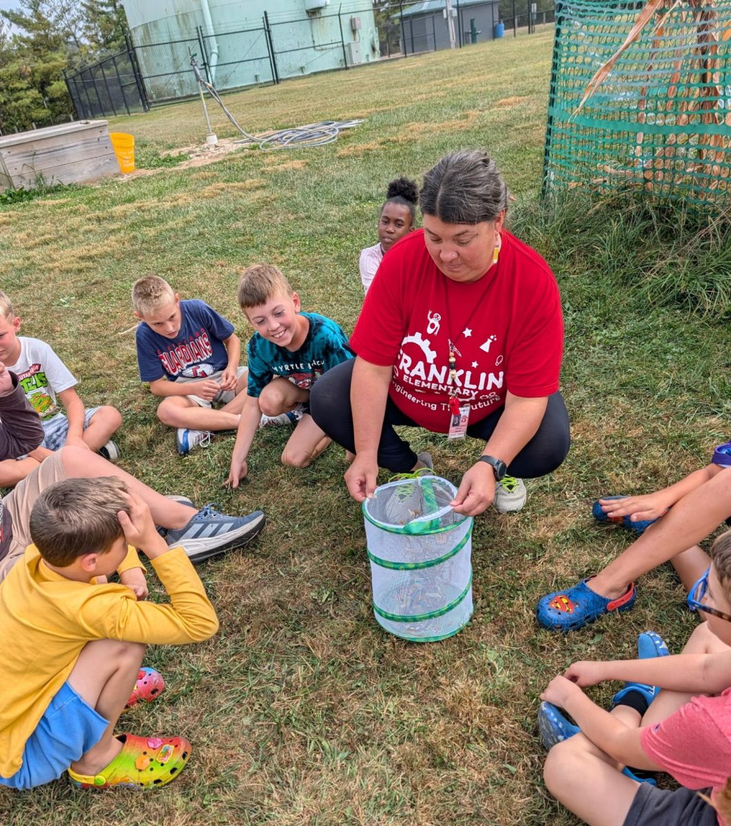 Melissa Martin releases butterflies that have been growing in her classroom. The students documented the process each week and would pick milkweed for the monarchs.