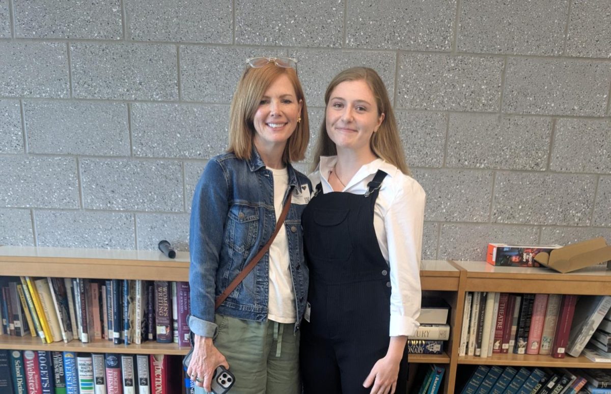 Author Ella Foutz poses with her mom after her first ever author greet with people. Her author greet included her reading exerpts from her book, commenting on student projects and a Q&A with students.